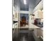 Bright kitchen with white cabinets, dark countertops, and stainless steel appliances at 4186 Buglers Rest Pl, Casselberry, FL 32707