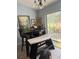 Bright kitchen with a black dining table and access to the outside patio at 4186 Buglers Rest Pl, Casselberry, FL 32707