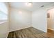 Empty bedroom featuring wood-look floors and a bright window at 4200 Colony Way, Orlando, FL 32808