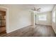 Bright bedroom with ceiling fan, neutral walls, and wood-look floors at 4200 Colony Way, Orlando, FL 32808