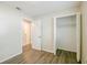 Bright bedroom with neutral walls, wood-look floors and closet at 4200 Colony Way, Orlando, FL 32808