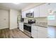 Bright kitchen with stainless steel appliances, granite countertops, and ample cabinet space at 4200 Colony Way, Orlando, FL 32808
