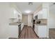 Modern kitchen featuring stainless steel appliances, granite countertops, and ample white cabinetry at 4200 Colony Way, Orlando, FL 32808