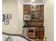 Convenient bar area with stainless steel refrigerator and sink, great for entertaining at 4400 New Broad St, Orlando, FL 32814