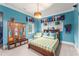 Bedroom with decorative pennants, and decor, and a view of the window at 4400 New Broad St, Orlando, FL 32814