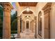 Grand entrance featuring stone columns, arched ceilings, and elegant lighting fixtures on a tile walkway at 4400 New Broad St, Orlando, FL 32814