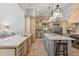 Bright and open kitchen featuring double islands, premium appliances, and lots of counter space at 4400 New Broad St, Orlando, FL 32814