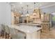 Spacious open kitchen features a large center island, pendant lighting, and brick accents at 4400 New Broad St, Orlando, FL 32814