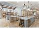 Open-concept kitchen with center islands, breakfast bar, and seamless flow to living area at 4400 New Broad St, Orlando, FL 32814
