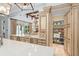 Bright kitchen with stainless steel refrigerator, brick backsplash and tiled floors at 4400 New Broad St, Orlando, FL 32814