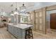 Expansive kitchen boasts double islands, stylish cabinetry, and convenient access to pantry at 4400 New Broad St, Orlando, FL 32814