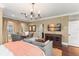 Well-appointed room with hardwood floors and large TV for entertainment at 4400 New Broad St, Orlando, FL 32814