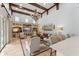 Spacious living room with high ceilings, wooden beams, and custom built-in entertainment center at 4400 New Broad St, Orlando, FL 32814