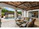 Inviting outdoor living space with comfortable seating and a view of the beautiful pool area at 4400 New Broad St, Orlando, FL 32814