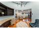 Open-concept sitting area featuring hardwood floors, custom built-ins, and comfortable seating at 4400 New Broad St, Orlando, FL 32814
