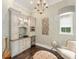 Charming sitting room with built-in cabinetry, a wet bar, and natural light from a window at 4400 New Broad St, Orlando, FL 32814