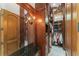 Custom walk-in closet features wood cabinetry, granite countertops, and a ladder for access to high storage at 4400 New Broad St, Orlando, FL 32814