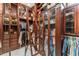 Spacious walk-in closet boasts custom wood cabinetry, shelving, and a convenient rolling ladder at 4400 New Broad St, Orlando, FL 32814