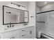 Modern bathroom showcasing a double sink vanity with black hardware, a walk-in shower and tile floors at 461 Black Knight Way, Longwood, FL 32779