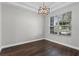 Bedroom showcasing dark hardwood floors, neutral walls, and lots of natural light at 461 Black Knight Way, Longwood, FL 32779