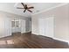 Light-filled bedroom featuring wood floors, a closet, and an open door to an en-suite bathroom at 461 Black Knight Way, Longwood, FL 32779