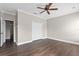 Spacious bedroom boasts wood floors, base trim, and a closet for ample storage at 461 Black Knight Way, Longwood, FL 32779