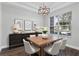Elegant dining area with modern light fixture, and stylish decor, perfect for entertaining at 461 Black Knight Way, Longwood, FL 32779