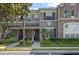 Charming townhome featuring a well-maintained lawn and appealing architectural details at 461 Black Knight Way, Longwood, FL 32779