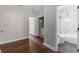 Hallway with a full bathroom and laundry room access at 461 Black Knight Way, Longwood, FL 32779