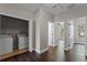 Hallway with laundry room access and views of other rooms in the home at 461 Black Knight Way, Longwood, FL 32779