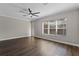 Bright living room with a large window, hardwood floors, and modern decor at 461 Black Knight Way, Longwood, FL 32779