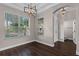 Bright living room showcasing hardwood floors and natural light from large windows at 461 Black Knight Way, Longwood, FL 32779