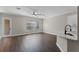 Bright and airy living room adjacent to the kitchen with stylish flooring and neutral tones at 461 Black Knight Way, Longwood, FL 32779