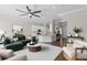 Open concept living space with modern furnishings, kitchen island, and a cozy atmosphere at 461 Black Knight Way, Longwood, FL 32779