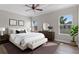 Tastefully designed main bedroom suite with neutral decor and a view of the surrounding landscape at 461 Black Knight Way, Longwood, FL 32779