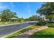Scenic street view with lush landscaping, gazebo, fountain, and community charm at 461 Black Knight Way, Longwood, FL 32779