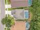 This home features an aerial view showcasing a screened in pool and well maintained landscaping at 4993 Hook Hollow Cir, Orlando, FL 32837