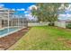 This home features a lovely back yard with a private pool and screened-in lanai at 4993 Hook Hollow Cir, Orlando, FL 32837