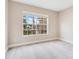 Neutral bedroom with a large window and plush gray carpeting at 4993 Hook Hollow Cir, Orlando, FL 32837