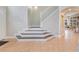 Elegant foyer with tile flooring, an open staircase, and access to the living areas at 4993 Hook Hollow Cir, Orlando, FL 32837