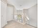 Upstairs hallway features neutral walls, carpet, and a white bannister and railing at 4993 Hook Hollow Cir, Orlando, FL 32837