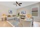 Comfortable living room with a neutral color palette, stylish furniture, and ample lighting at 4993 Hook Hollow Cir, Orlando, FL 32837
