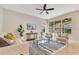 Cozy living room with comfortable seating, decorative rug, and natural light at 4993 Hook Hollow Cir, Orlando, FL 32837