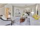 Spacious living room connecting to the dining area, with elegant decor and ample seating at 4993 Hook Hollow Cir, Orlando, FL 32837