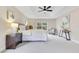 Bright primary bedroom features neutral walls, a tray ceiling, and a large window at 4993 Hook Hollow Cir, Orlando, FL 32837