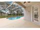Screened in pool and patio with lush landscaping at 4993 Hook Hollow Cir, Orlando, FL 32837