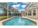 Screened pool with backyard view and patio area at 4993 Hook Hollow Cir, Orlando, FL 32837