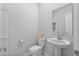 This minimalist half-bath includes modern fixtures and a streamlined design at 5220 Red Coral Cir, Mount Dora, FL 32757