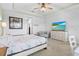Bedroom with ceiling fan, television, and desk at 5220 Red Coral Cir, Mount Dora, FL 32757
