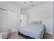 A modern bedroom includes a double closet and neutral color scheme, a soothing and organized retreat at 5220 Red Coral Cir, Mount Dora, FL 32757